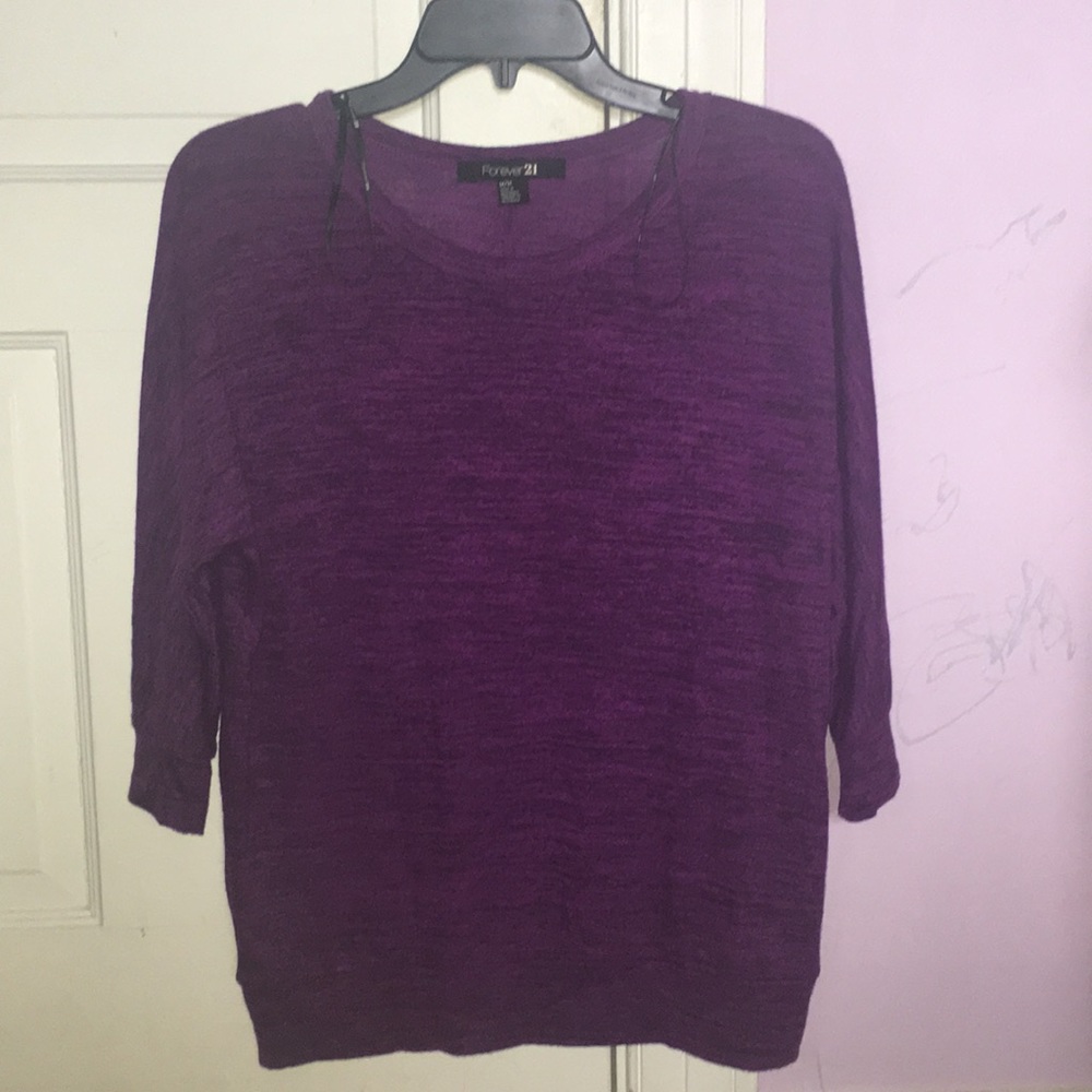 A purple shirt/sweater